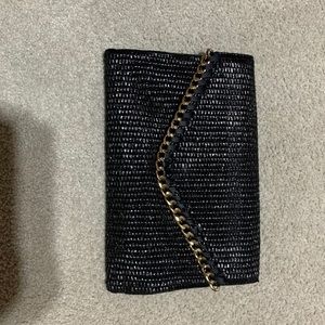 Black ALDO clutch with gold details